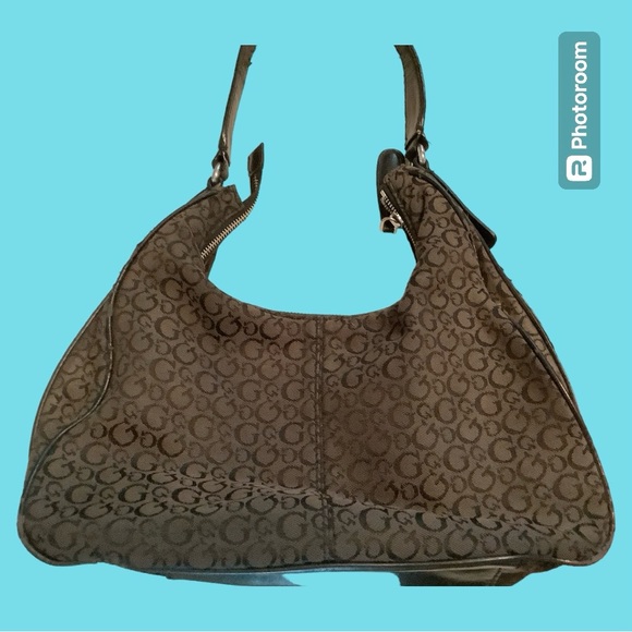 Guess Handbag, front pocket snaps shut, Inside has 1 zipper & 3 slide pockets. - Picture 2 of 8